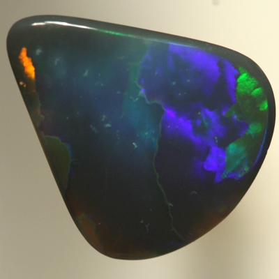 SOLID BLACK OPAL Two large rolling flashes of neon greens to ultra violet. SEE VIDEO